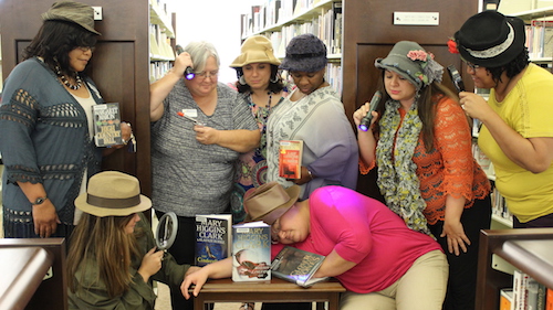 Perkinston Campus library workers dressed as characters from detective/crime novels written by women